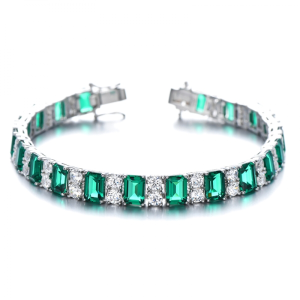 Tennisarmband mit grünem Smaragd/Diamant im Smaragdschliff
         