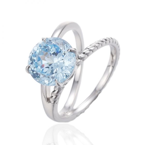 Ring aus Rhodium-Silber mit rundem Diamant und blauem Kubikzircon 