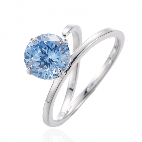 Ring aus Rhodium-Silber mit rundem Diamant und blauem Kubikzircon 